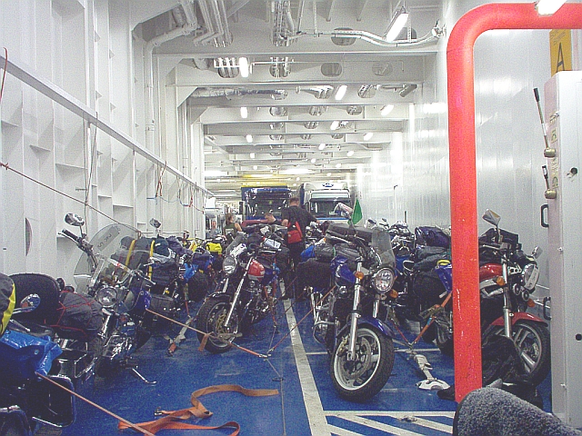 lost of motorbikes all strapped down in the ferry